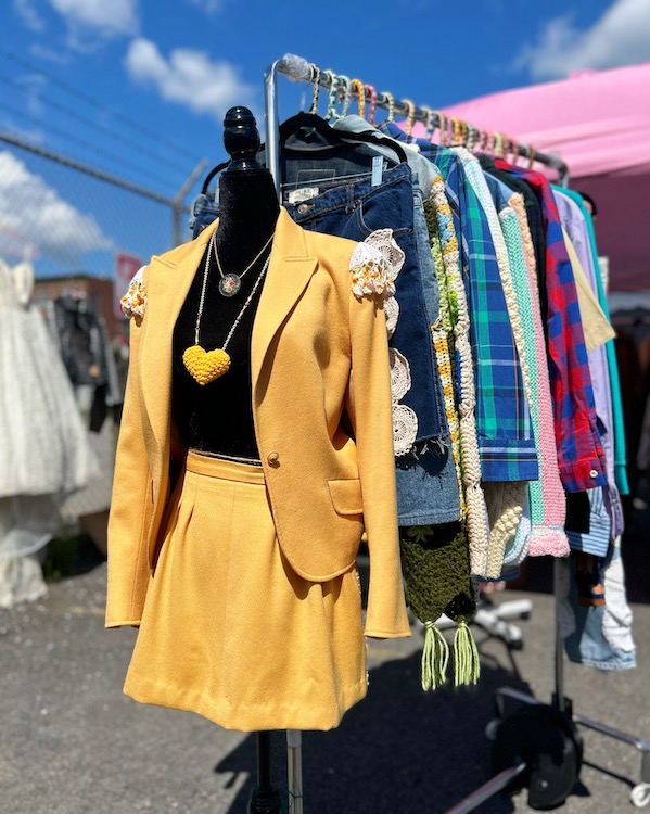 Colorful vintage clothing on rack at Red Owl Flea in Kingston, NY.