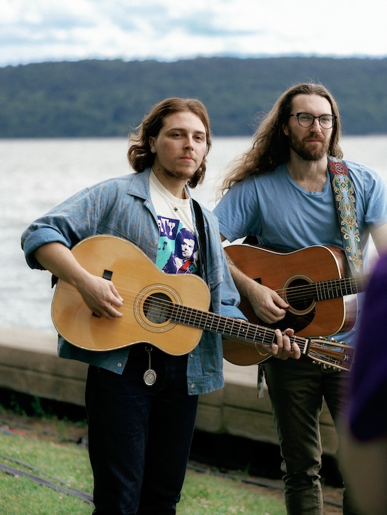 Donato and Lesh posing for the camera by the Hudson River at the Hudson River Music Festival in Croton Point Park NY.