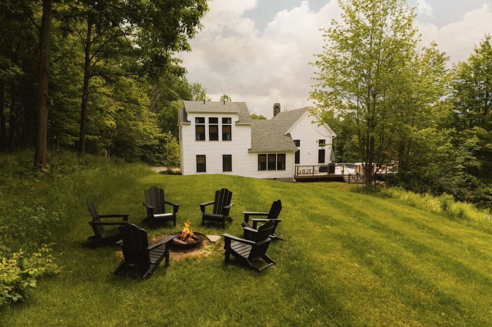 Backyard with fire pit at 648 Scudder Hill Rd, Roxbury NY.