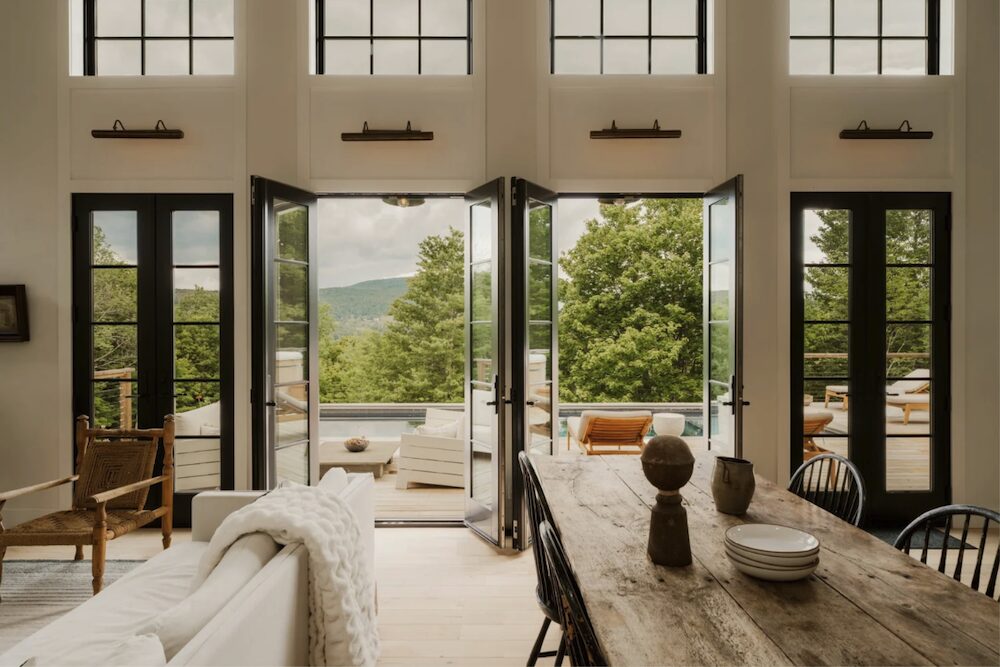 Opened glass doors to the porch and pool at 648 Scudder Hill Rd, Roxbury NY.