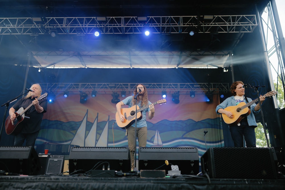 Haynes, Lesh and Donato singing "Ohio" on stage at the Hudson River Music Festival in Croton Point Park NY.
