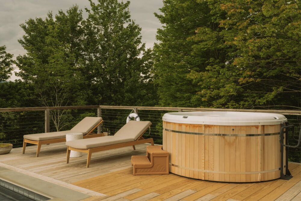 Hot tub on a private deck overlooking the expansive mountain views at 648 Scudder Hill Rd, Roxbury NY.