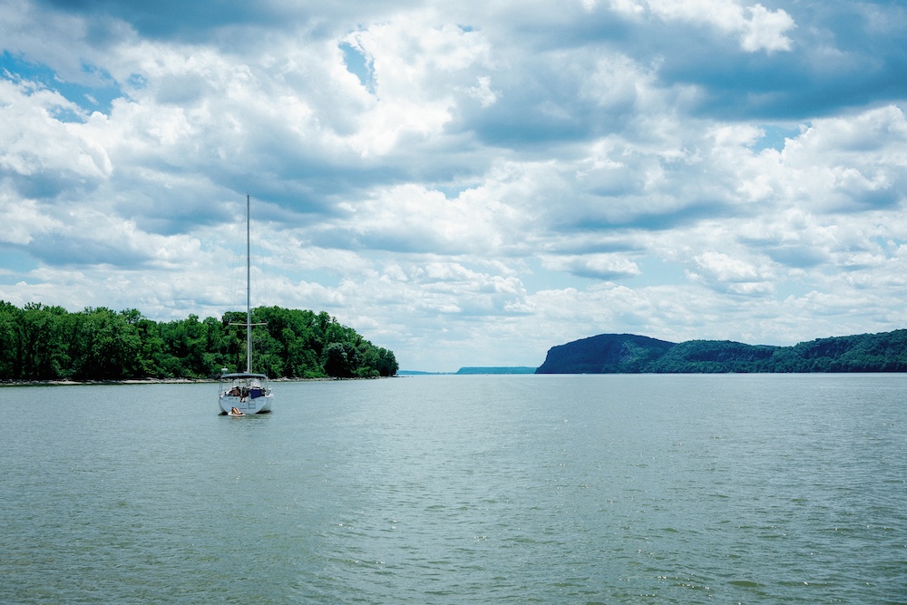 Sailboat on the Hudson River at the Hudson River Music Festival in Croton Point Park NY.