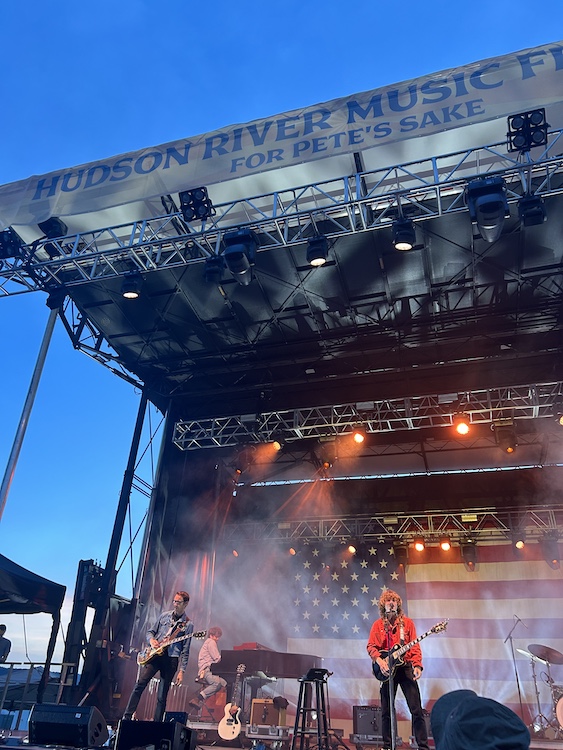 For Pete's Sake Banner above Jesse Welles' band on stage playing at the Hudson River Music Festival in Croton Point Park NY.