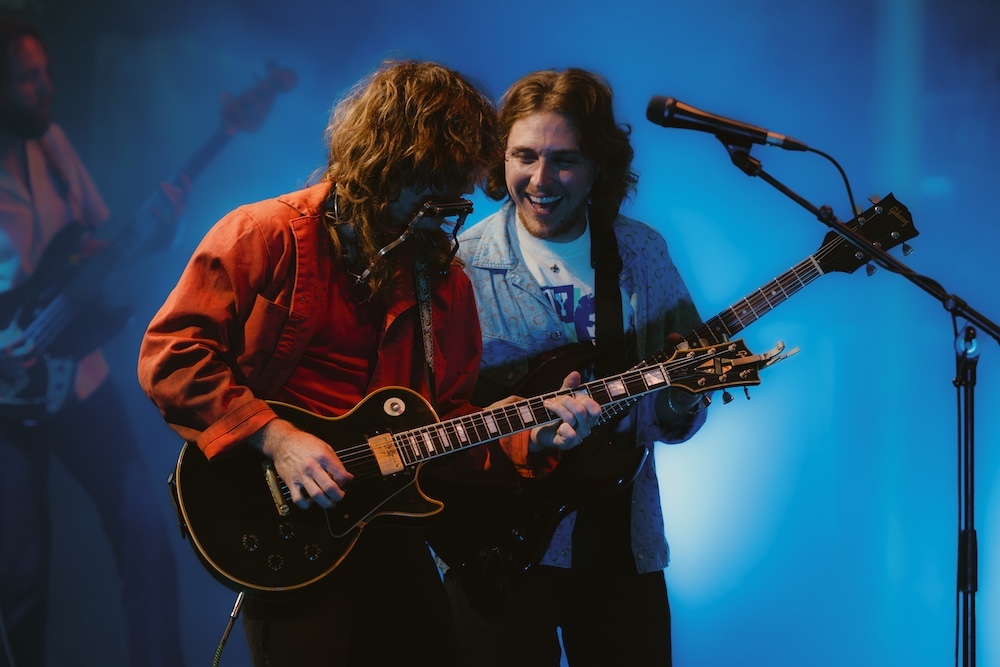 Jesse Welles and Daniel Donato playing together on stage.