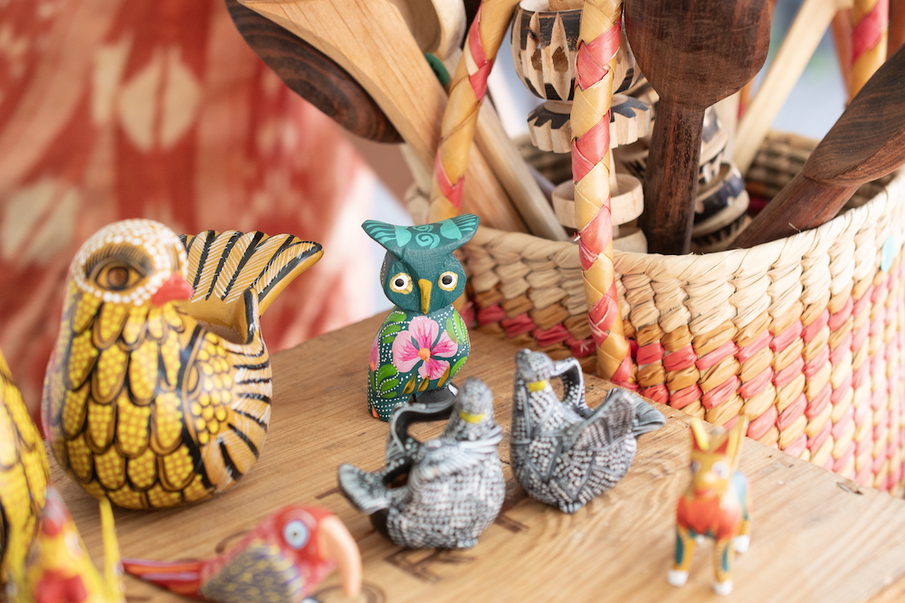 Little owl, various figurines, wooden spoons at Red Owl Flea in Kingston, NY.