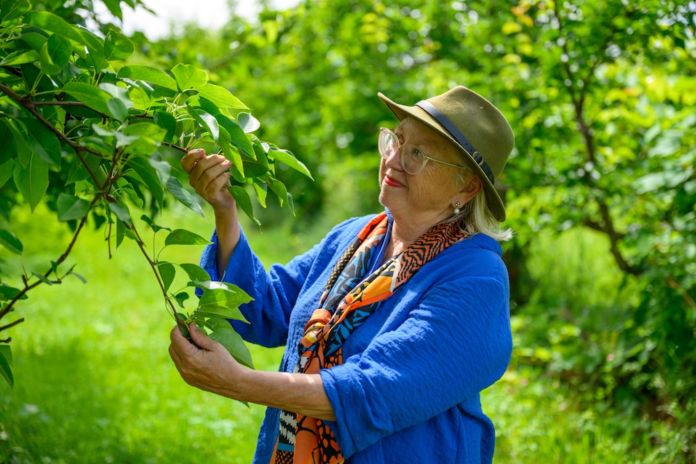 Elizabeth Ryan looking at the naked apple trees at Stone Ridge Orchard.