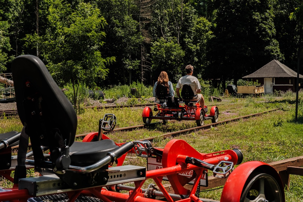 Couple riding a railbike at Rail Explorers Catskills Division