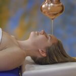 Shirodhara warm oil dripping on your third eye at Menla Retreat & Dewa Spa.