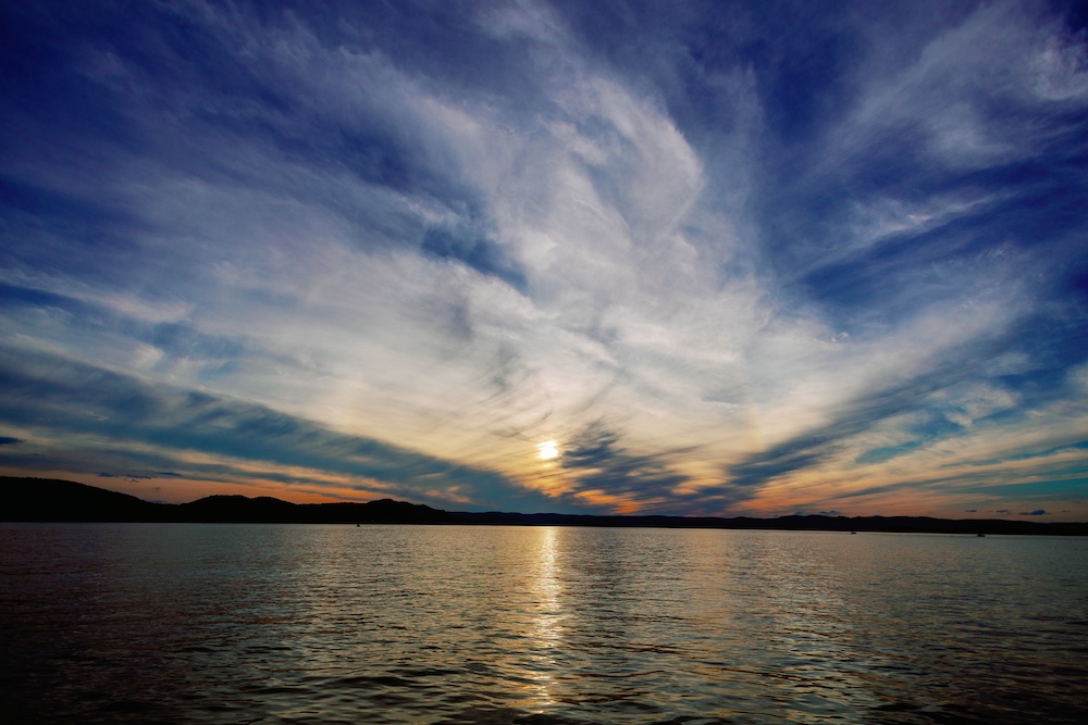 Sunset on the Hudson River at the Hudson River Music Festival in Croton Point Park NY.