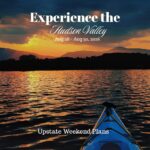 An I Paddle NY kayak floating into the sunset of the Ctskill Mountains with the "Experience the Hudson Valley" and "Upstate Weekend Plans" text written across the photo.