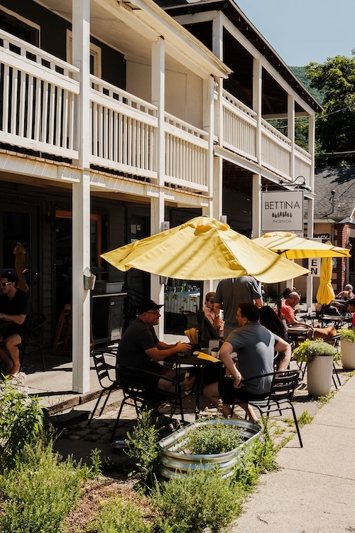People sitting outside at Bettina Café & Market in Phoenicia NY.