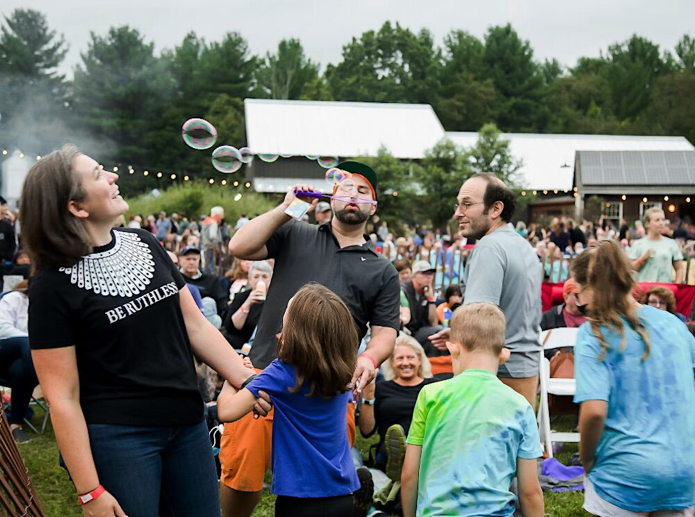 Families and people enjoying the show and making bubbles at Arrowood Farms Brewery & Distillery in Accord NY.