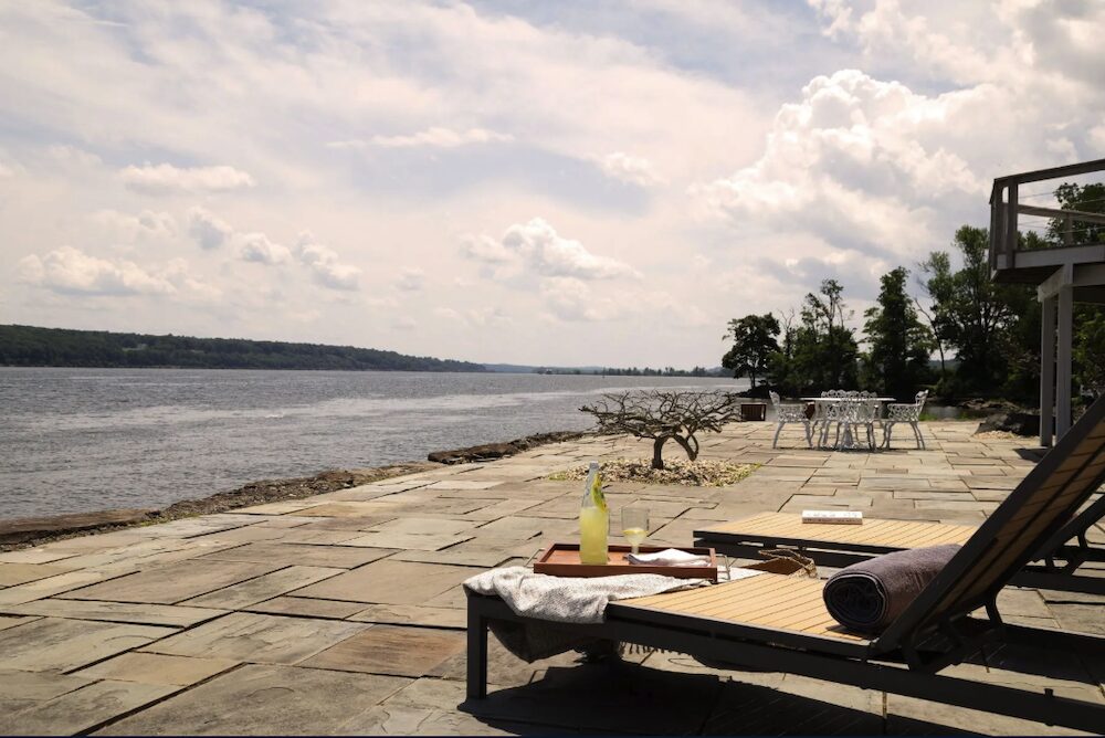 The deck and chairs next to the river at 63 River Road, Malden NY.