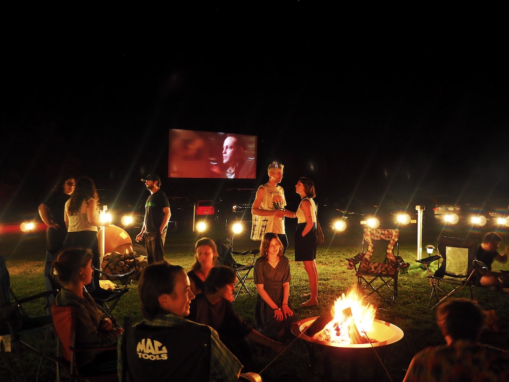 People gathered around the firepit to make s'mores and build community at Hi-Way Drive-In Theater in Coxsackie NY.