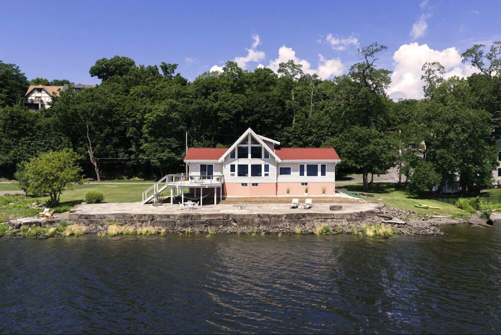 An aerial view of the house by the river at 63 River Road, Malden NY.
