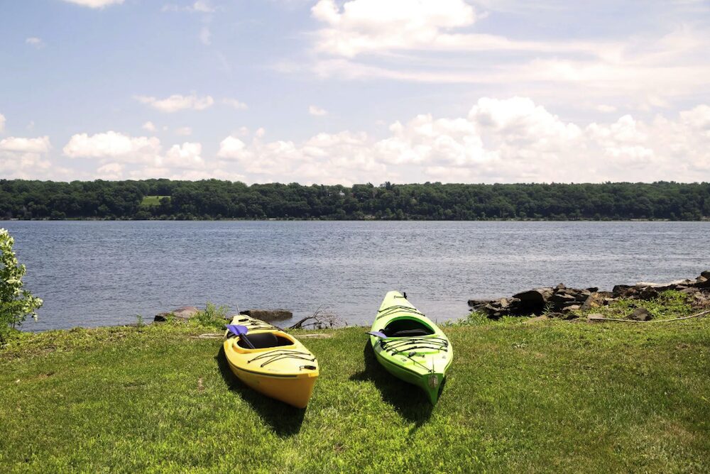 two kayaks on the lawn next to the Hudson River at 63 River Road, Malden NY.