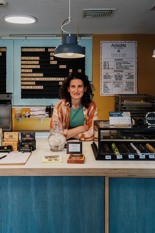 The owner of Fruition Chocolate at the counter in Shokan NY