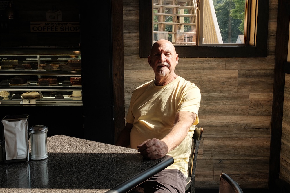 Owner Mike is sitting at Brio's Pizzeria and Restaurant in Phoenicia NY