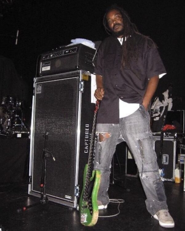 Darryl Jenifer on stage with his green bass.