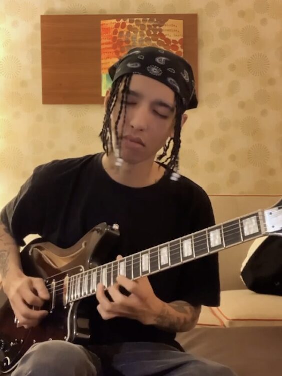 Chogyi Marco playing guitar