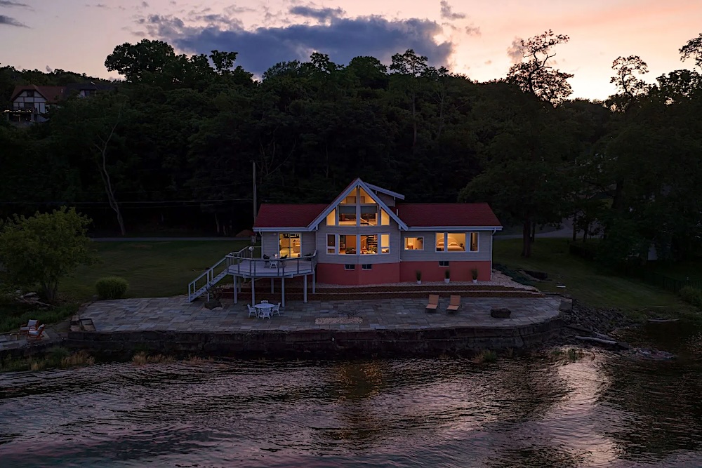 Post sunset evening aerial view of the house at 63 River Road, Malden NY.