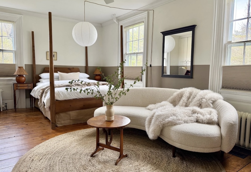 farm bedroom with curved sofa
